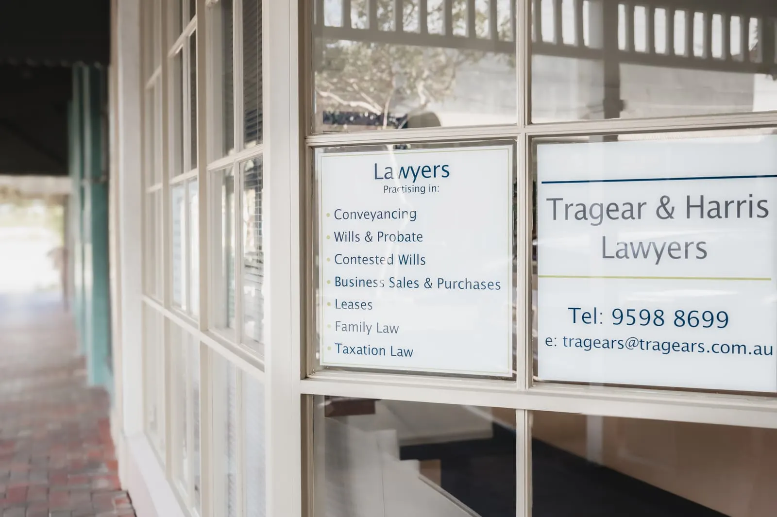 Tragear & Harris Lawyers window signage